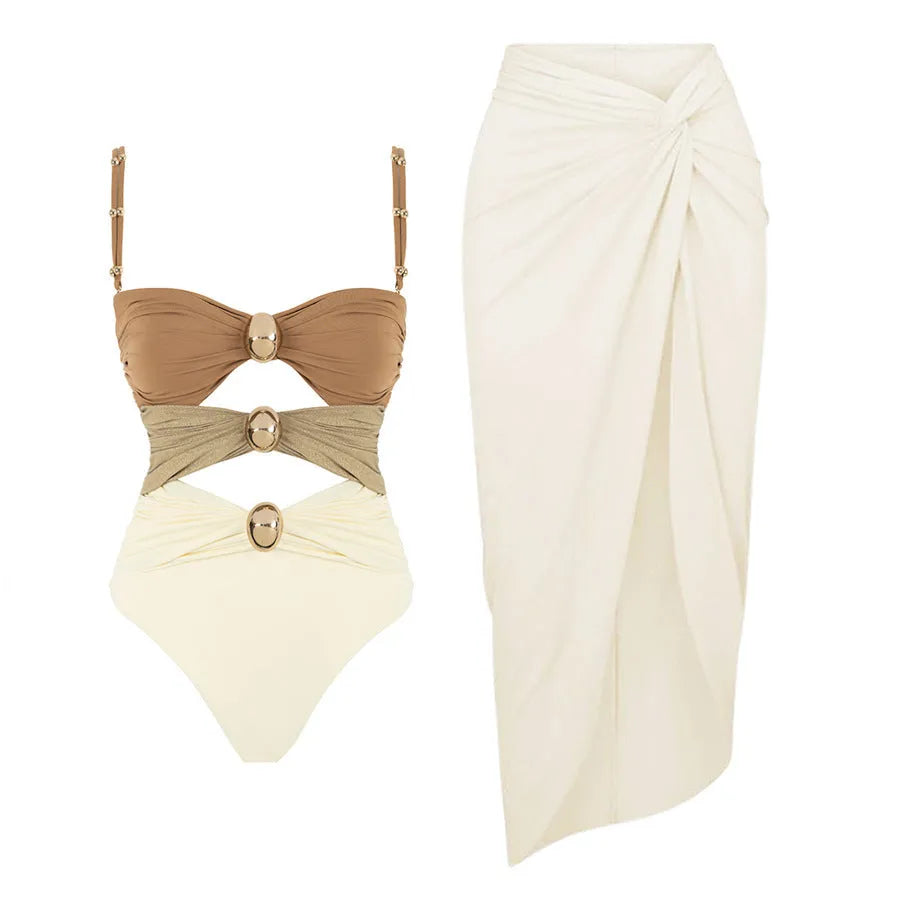 Women's solid colour one-piece swimsuit with detachable skirt and gold button detail