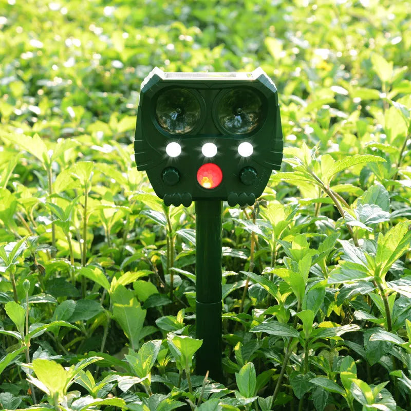 Green solar ultrasonic animal repeller unit with solar panel and LED lights