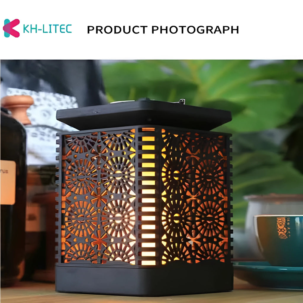Set of four black solar-powered LED lanterns with flickering flame effect for garden paths.