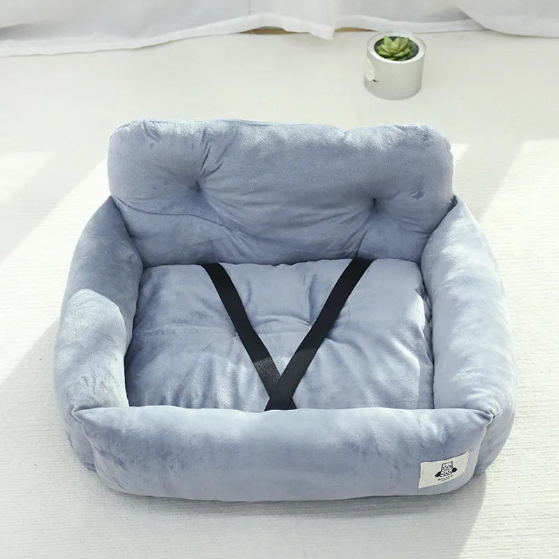 Car-mounted pet carrier nest in blue plaid cloth for dog transport