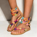 Women's ethnic beaded petal Roman sandals with floral decoration on a brown PU upper