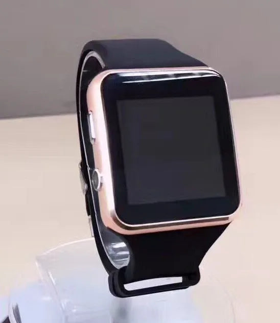 Black smart watch with a 1.54-inch touch screen and a black silicone strap on a wrist.