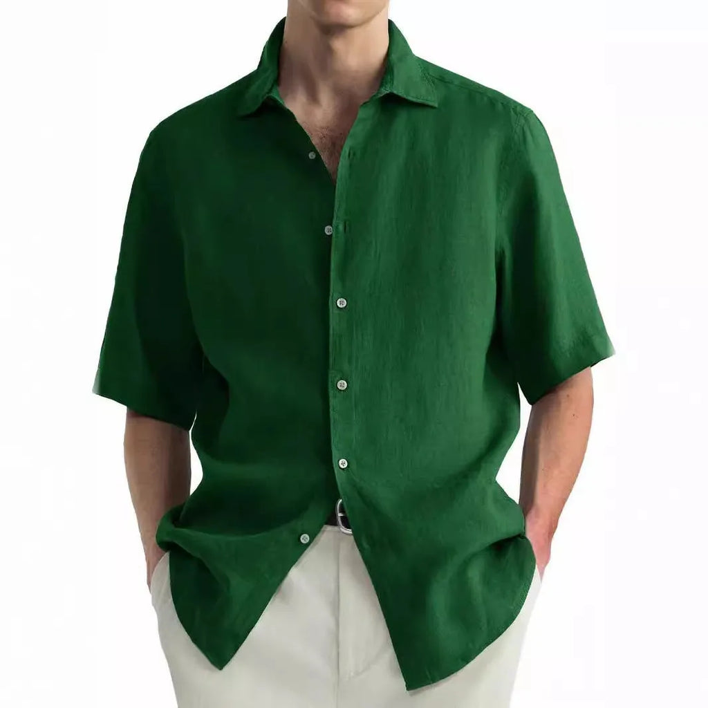 Man wearing a green washed cotton casual shirt in a regular fit, available with matching trousers.