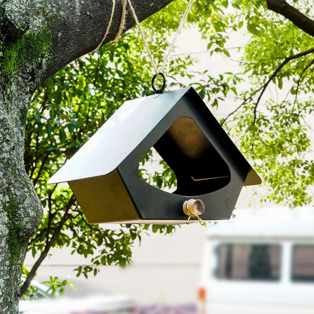 European-style iron bird nest feeder in garden setting with modern simple design