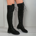 Black women's lace-up over the knee boots with round toe and flat rubber sole on a neutral background.