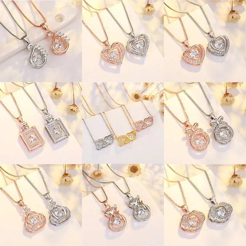 Silver tone heart pendant necklace with crown and bow charms on model