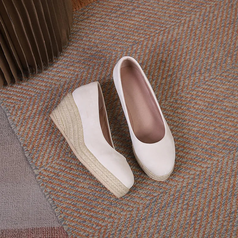 Women's apricot wedge high heel pumps with round toe and shallow mouth on a white background.