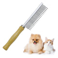 Wooden handle pet grooming comb for dogs and cats on a table.