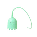 Green automatic electronic cat wand toy with swinging silicone tails on a table.