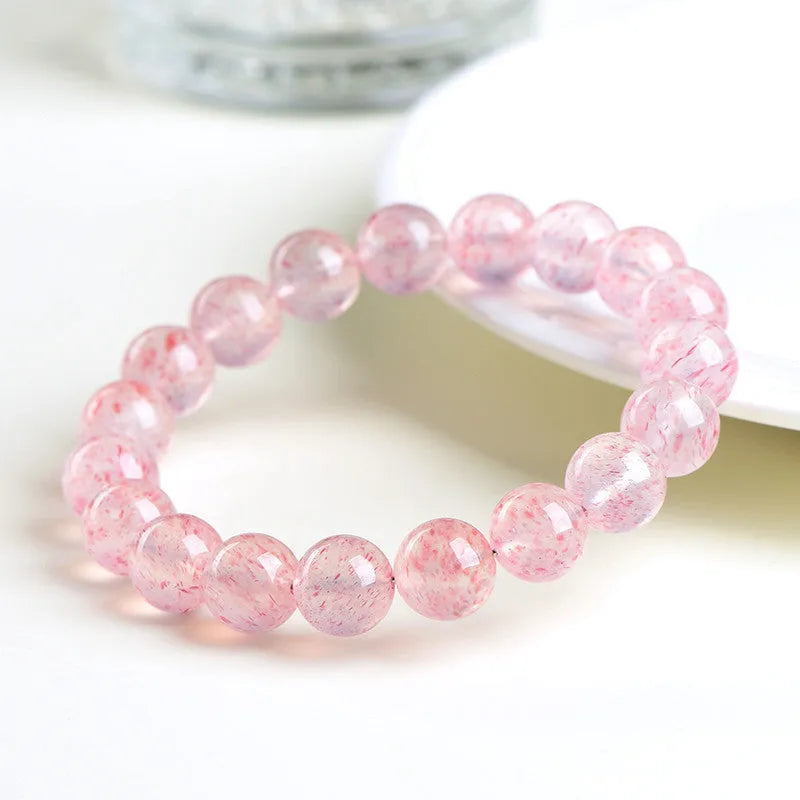 Natural white water strawberry quartz crystal bracelet with 10-10.8mm geometric beads.
