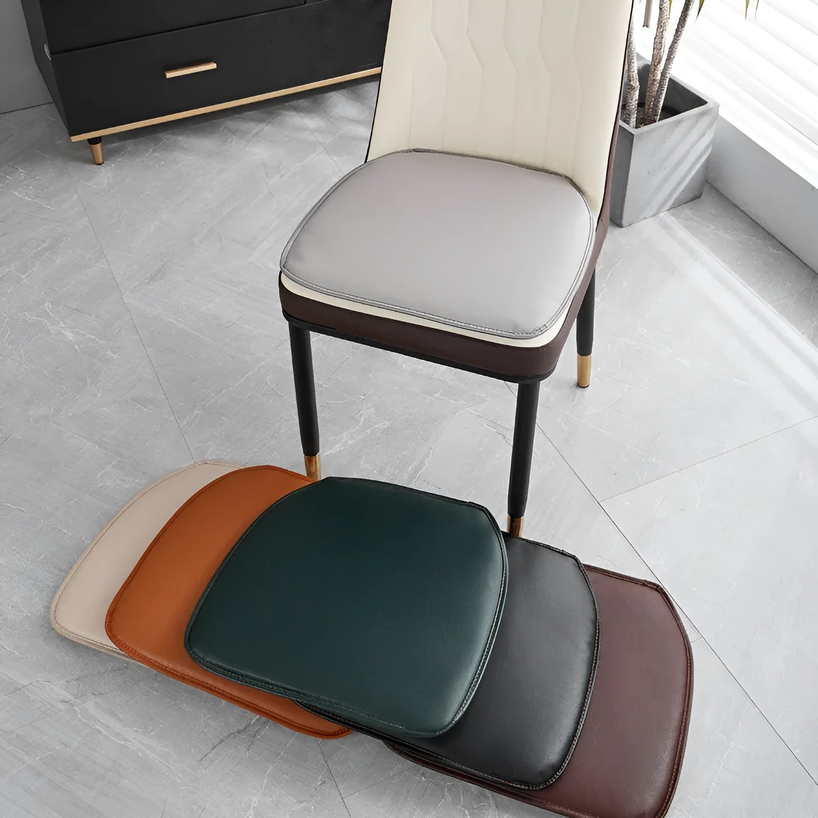 Leather horseshoe-shaped seat cushion in beige, showing non-slip base and thick padding.
