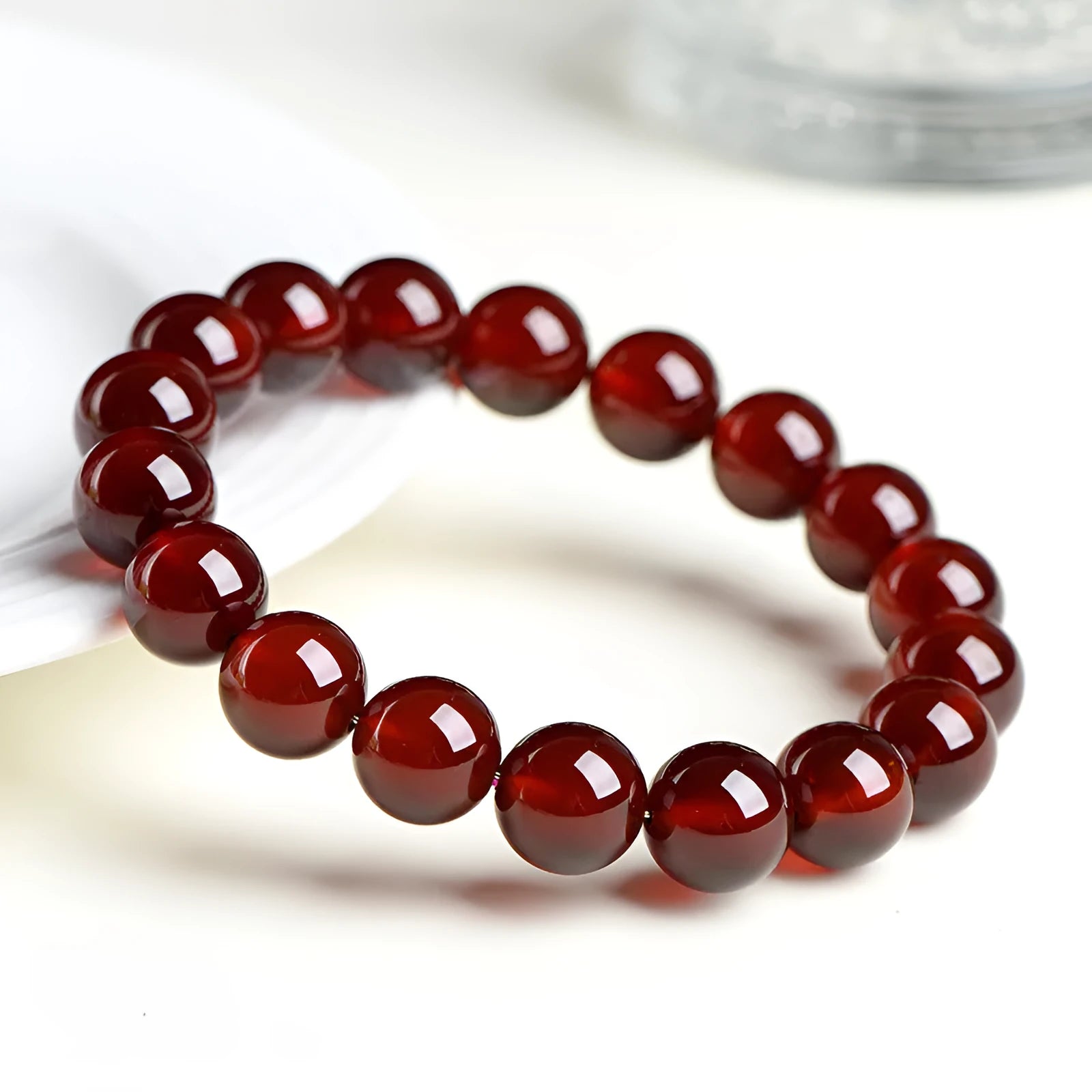 Natural Orange Red Garnet ball crystal bracelet with retro styling and Ruyi element in unisex design
