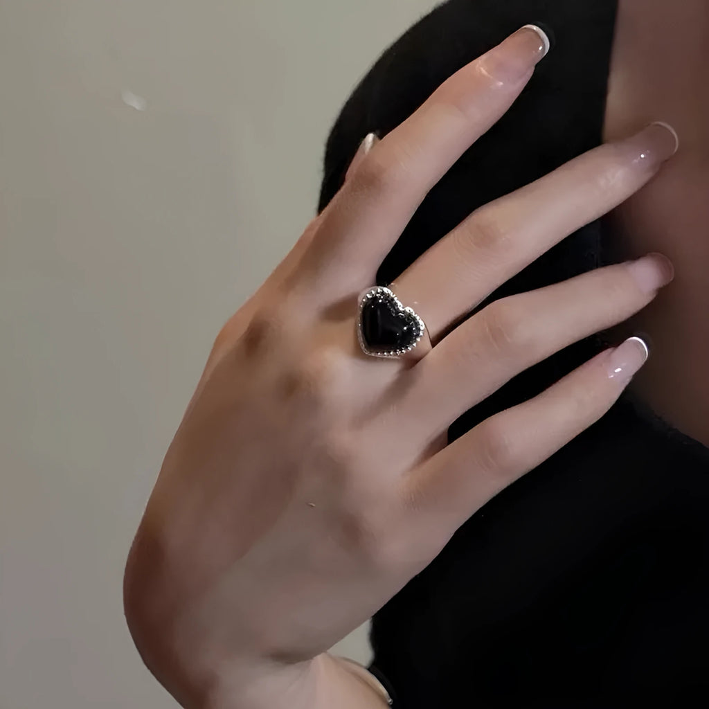 Adjustable sterling silver ring with heart-shaped black agate stone and open mouth design