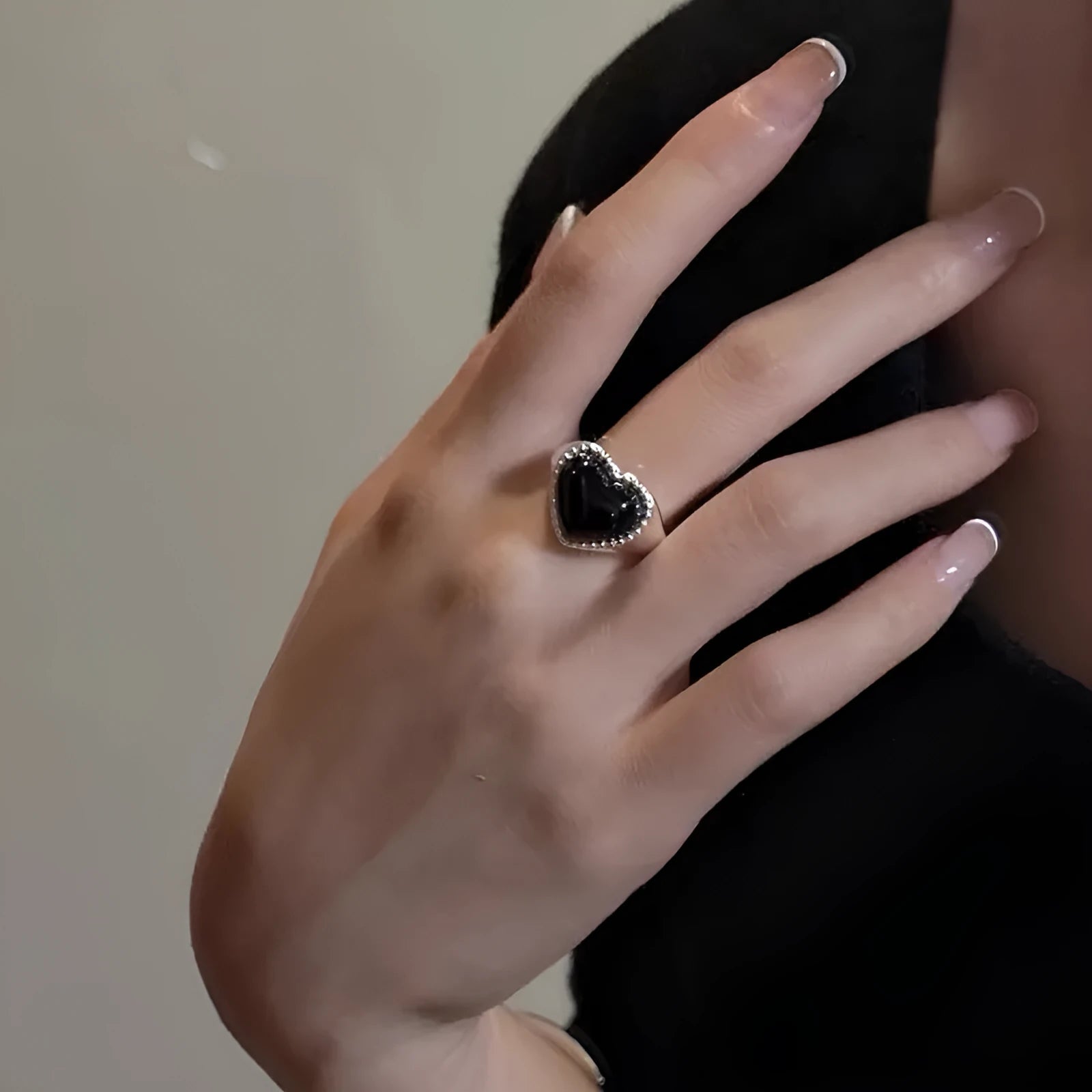 Adjustable sterling silver ring with heart-shaped black agate stone and open mouth design