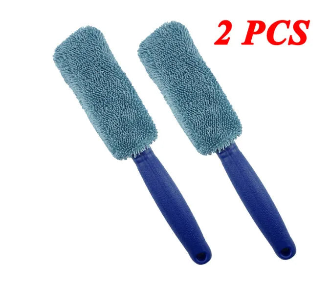 Blue long-handled microfiber brush for cleaning car tyres and wheels on a grey background.