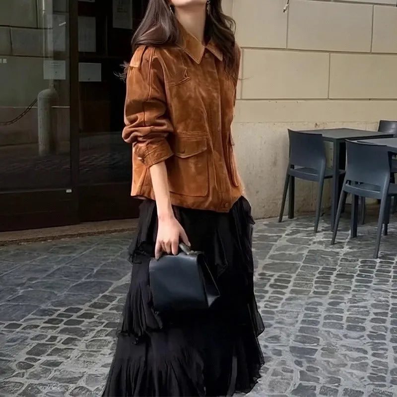 Women's bright brown suede coat with regular sleeves on a hanger