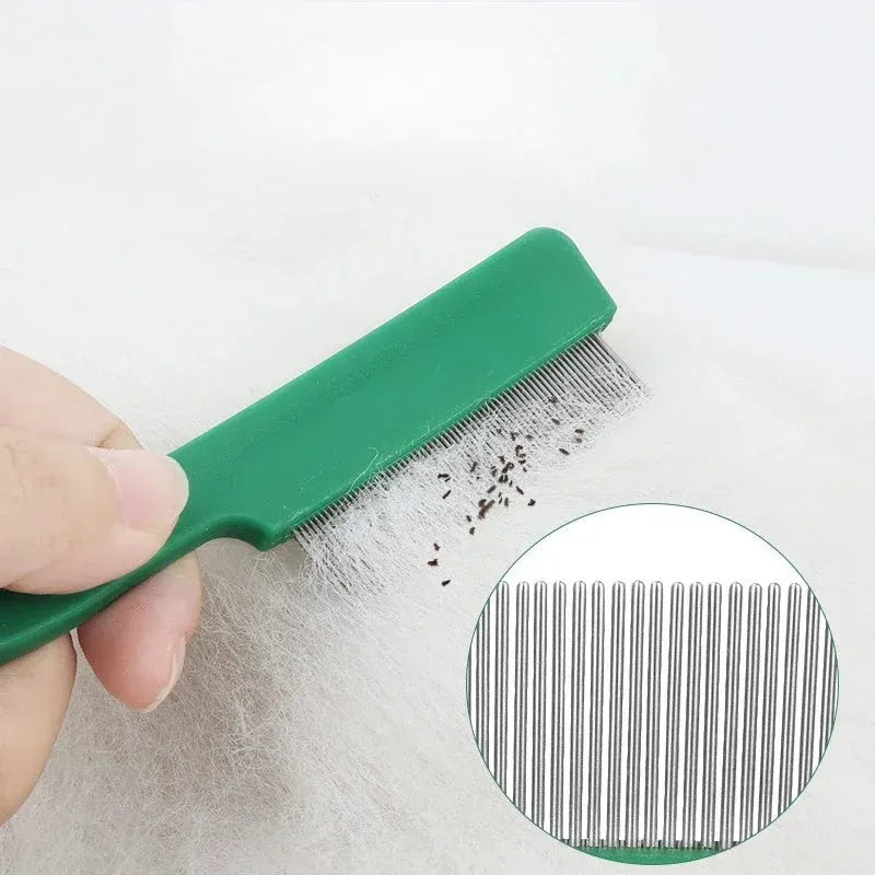 Green plastic handle stainless steel pet flea comb for dogs and cats on a plain background.