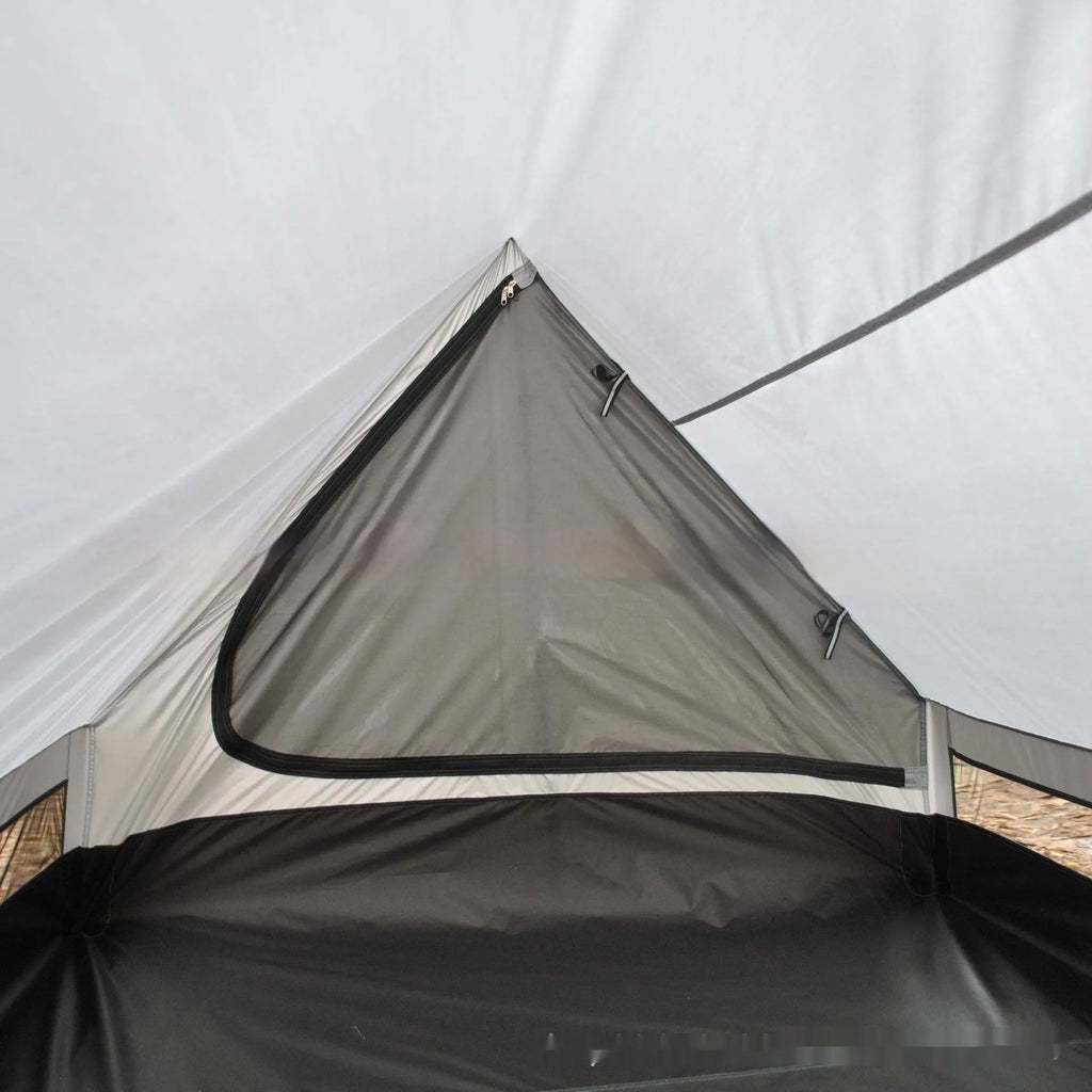 Brown A-line cabin tent setup with hiking pole supports showing spacious interior and waterproof fabric construction