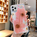 Floral TPU phone case with large pink and yellow flower designs for iPhone models