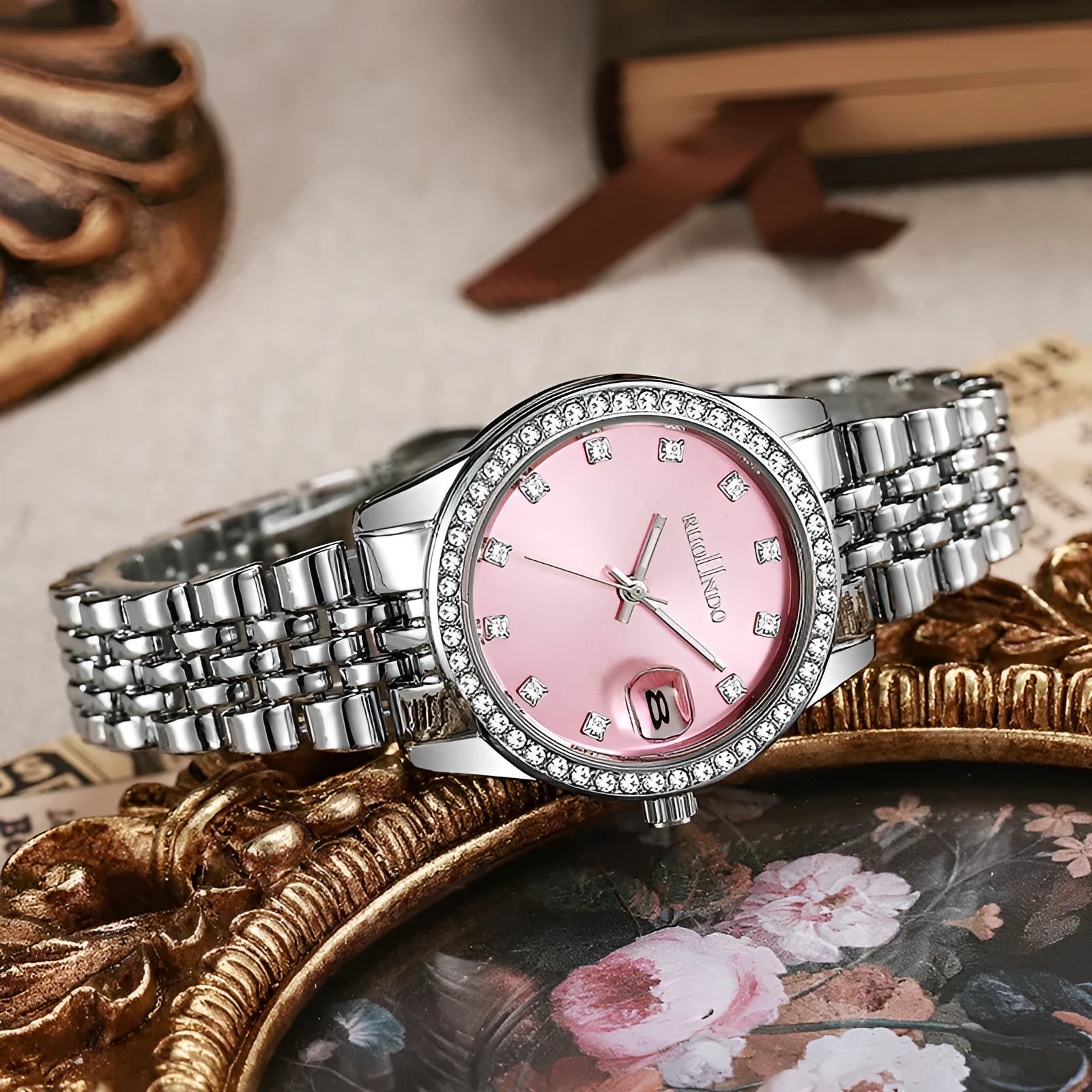 Women's silver calendar watch with circular dial and stainless steel buckle on alloy strap