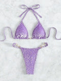Blue and green leopard print women's bikini set on a mannequin, showing T-shaped design.
