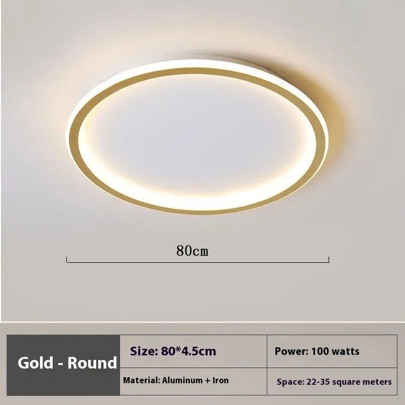 Minimalist flat disc LED ceiling light in black, white or gold finish.