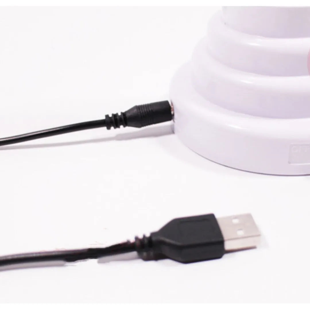 White tube bamboo shape desktop lamp emitting green light with USB cable
