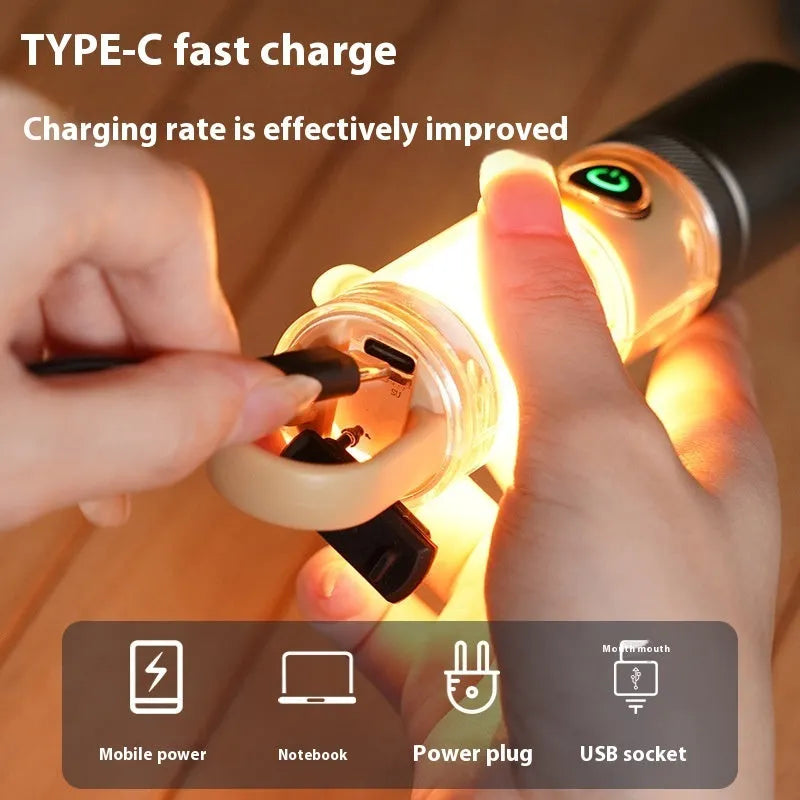 Orange and beige multifunctional flashlight with dual light source, hook attachment, and optical zoom feature