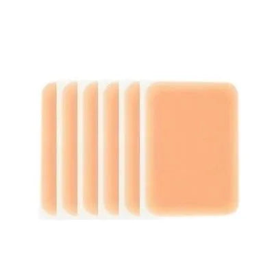 Tattoo cover patch kit with applicator brush for concealing birthmarks and tattoos in skin-coloured shades.