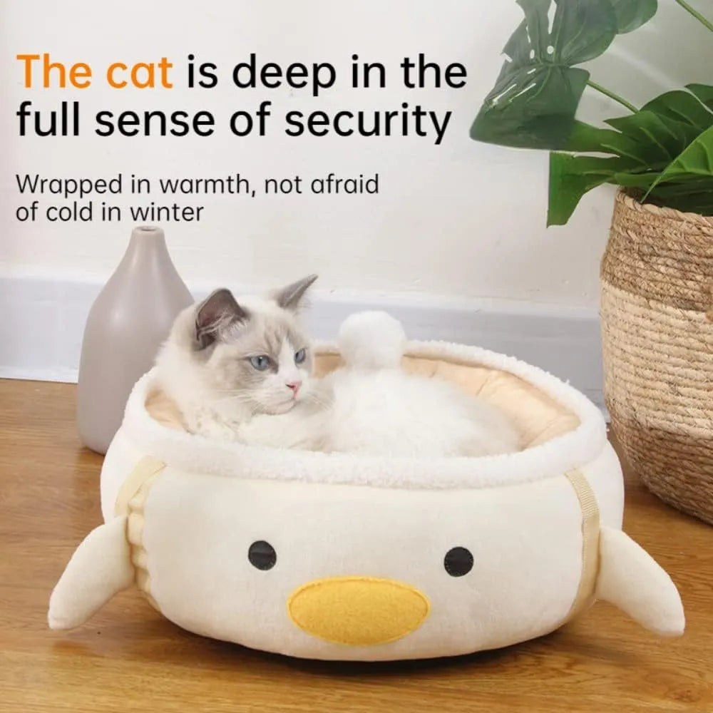 Green dinosaur and chick shaped cat bed that can be used flat or hung as a hammock