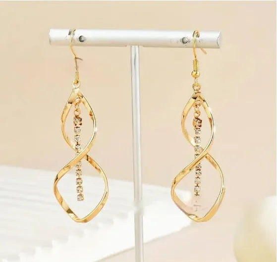 Gold-coloured spiral design alloy earrings with elliptical geometric details