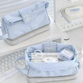 Dark blue folding double layer pencil case with internal compartments open to show organisation
