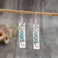 Silver geometric earrings with turquoise inlay in long strip retro design