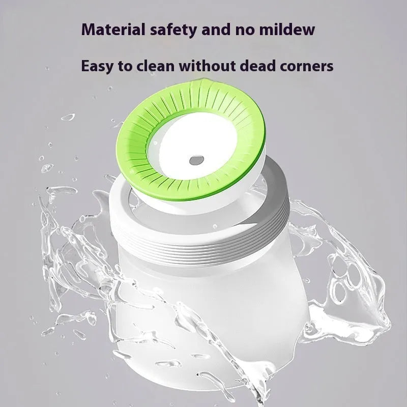 Green non-wet mouth suspension pet water bowl for dogs and cats on a white plate