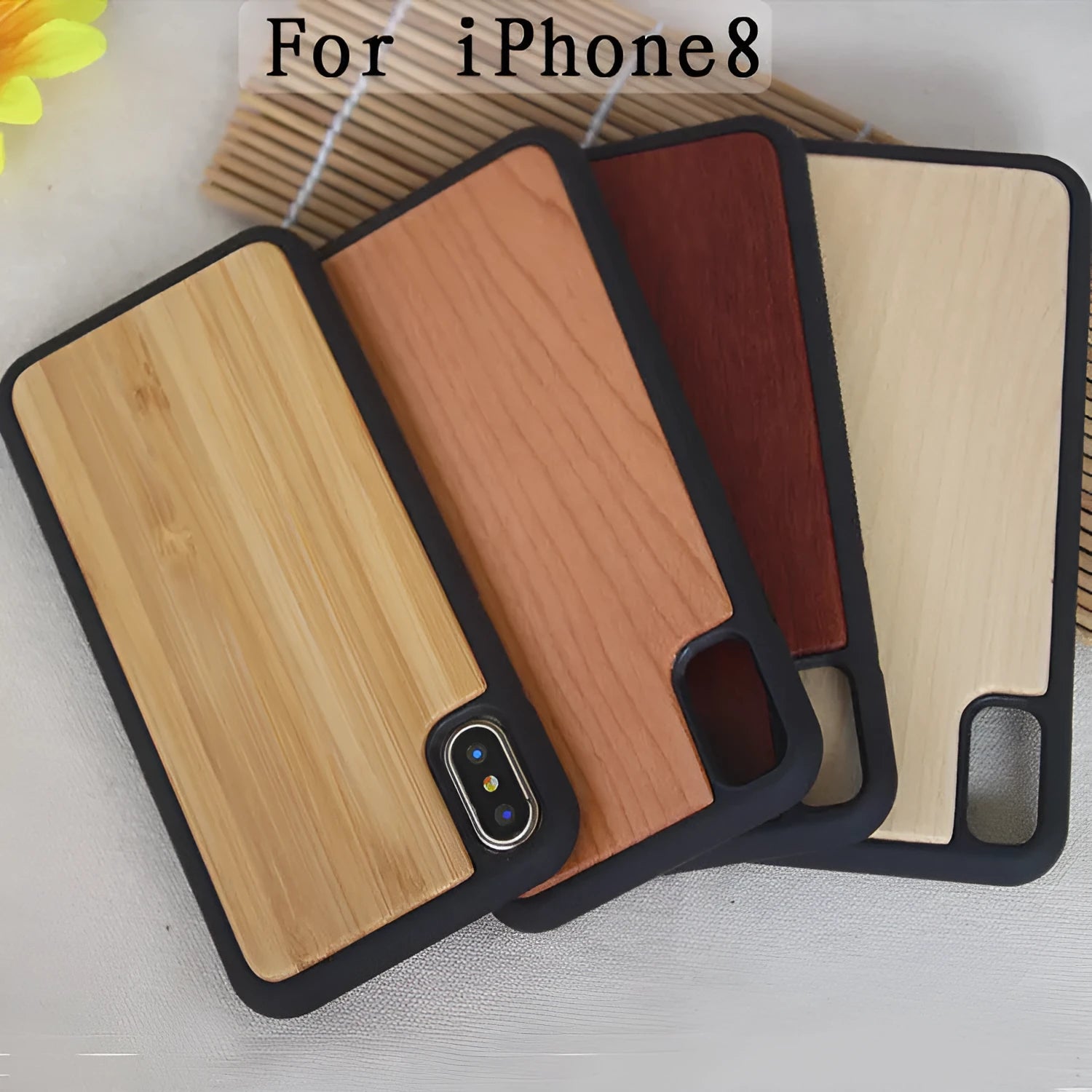 Wooden iPhone case with carbonised bamboo back and black TPU bumper for various iPhone models.