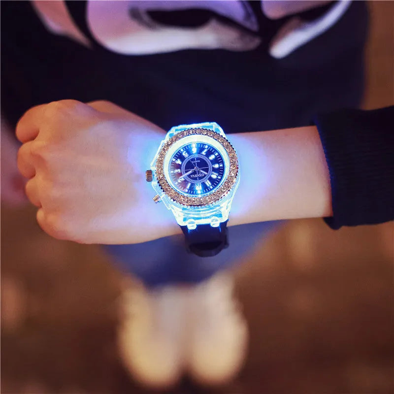 Women's LED luminous quartz watch with round dial, silicone strap, and luminous display features