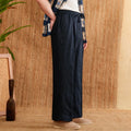 Women's linen trousers in high-waisted loose fit with elasticated waistband in navy blue colour
