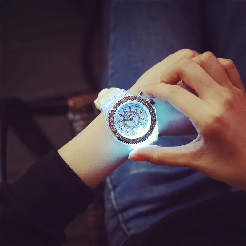 Women's LED luminous quartz watch with round dial, silicone strap, and luminous display features
