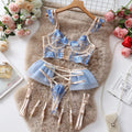 Light blue embroidered lace push-up bra and matching pants set on a mannequin.