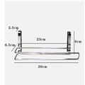 Silver stainless steel paper towel holder mounted on a kitchen cabinet door.