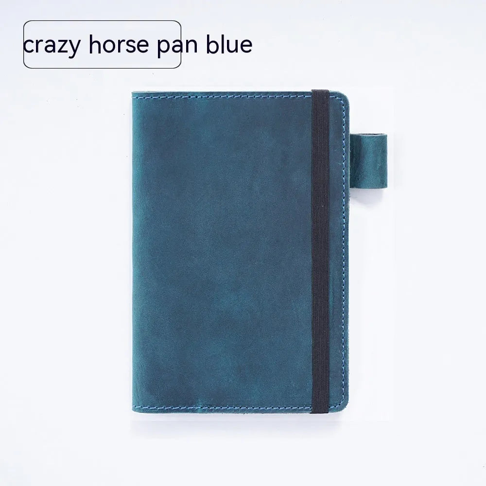 Handmade old-fashioned kraft notebook with cowhide cover, open to show 9x14cm wood-free paper