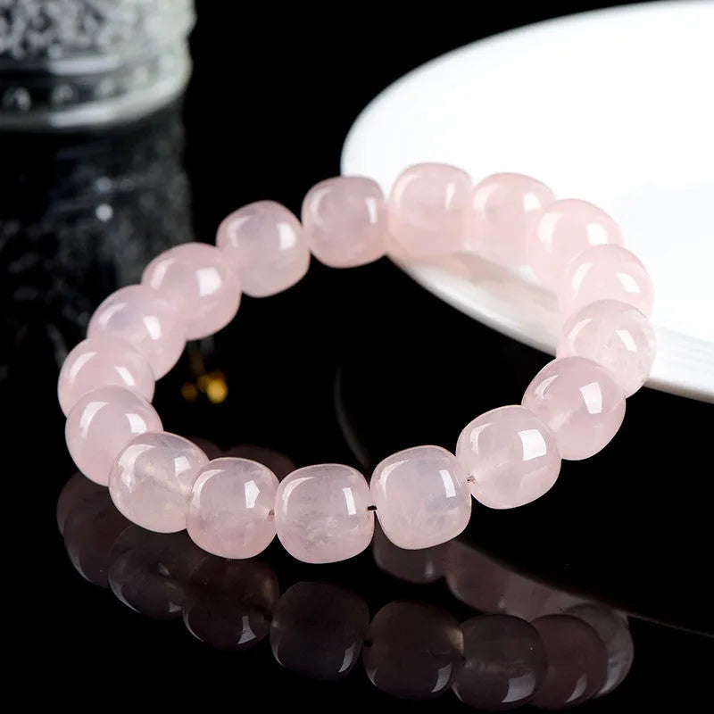 Natural bamboo crystal barrel bead bracelet with geometric pink beads measuring 11-12mm
