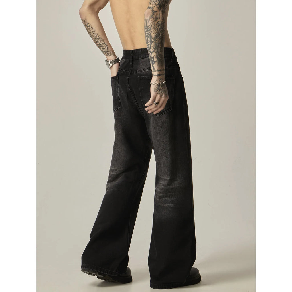 Black loose straight-leg jeans with retro styling and zipper fly