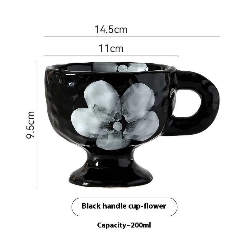 A handmade, irregularly shaped ceramic mug in a solid colour, shown on a table.