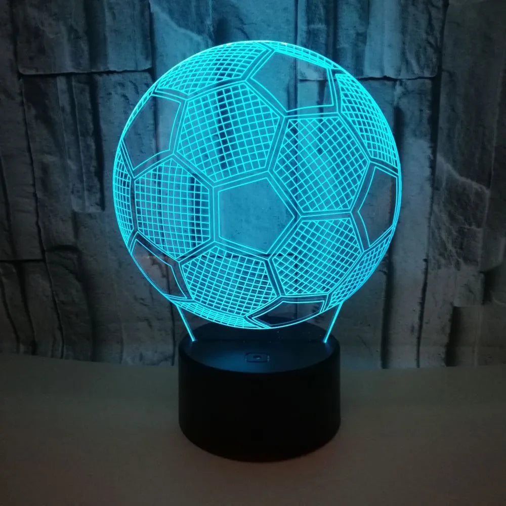 3D football shaped night light with colourful LED illumination on a black ABS base.