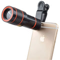 12X magnification phone telescope lens with adjustable clip attached to smartphone