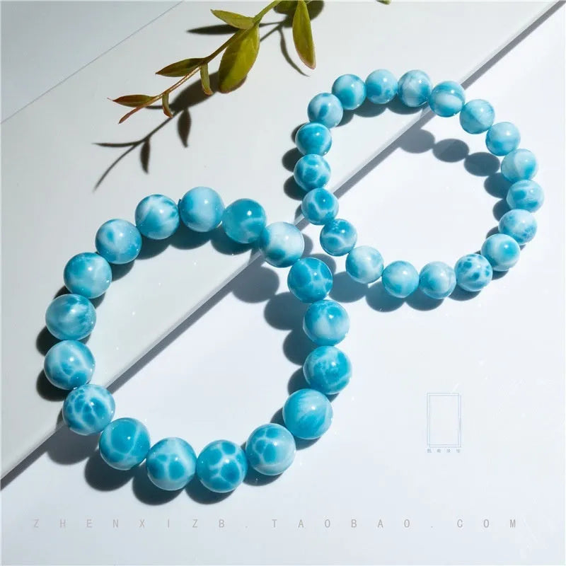 Blue Maillard style bodhi bracelet with natural crystal, sea-pattern stone, and a pearl bead.