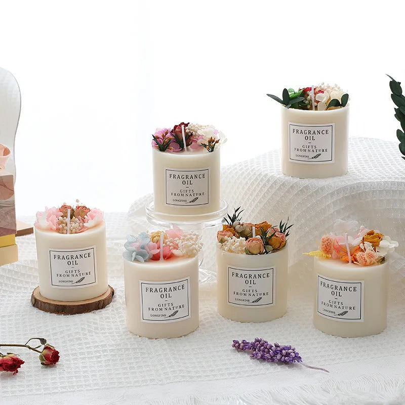 Aromatherapy candle with dried flowers embedded in wax, shown with optional wooden chip base and gift box.