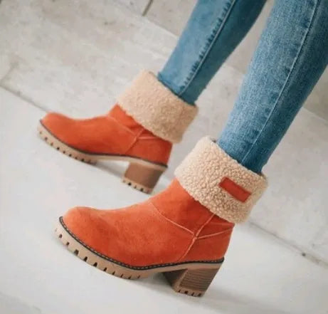 Women's mid-tube suede snow boots in black with a thick heel and waterproof platform.