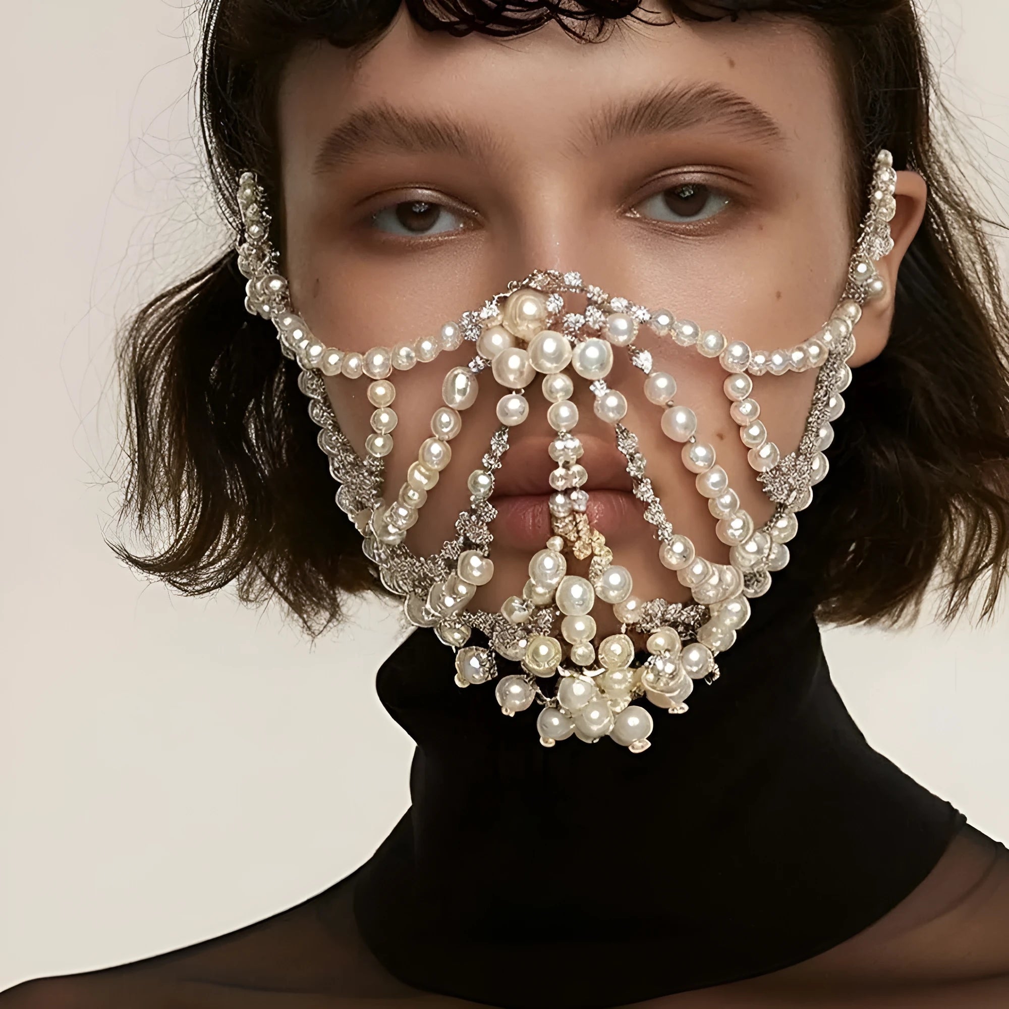 Geometric alloy mask with electroplated finish and gemstone decoration in silver colour